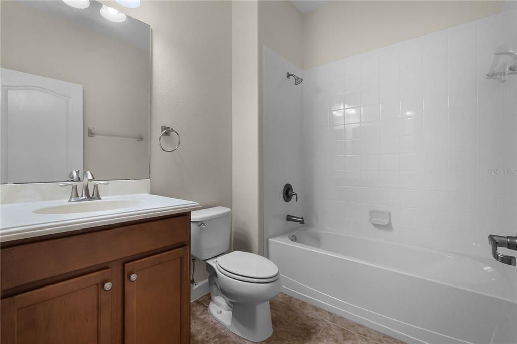 FULL BATHROOM #3: Located adjacent to Bedroom #3, Shower/Tub Combo, Ceramic Tile Flooring
