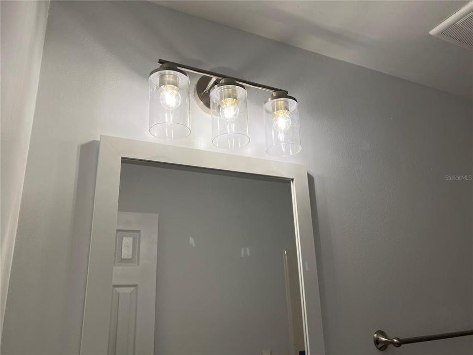 Bathroom w/new lighting fixture & mirror