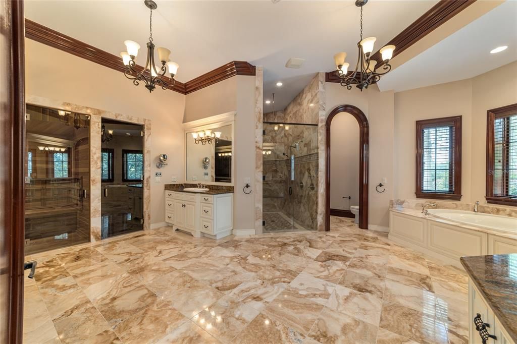 Master bathroom suite with steam room sauna, large walk in shower and overflow soaking tub.