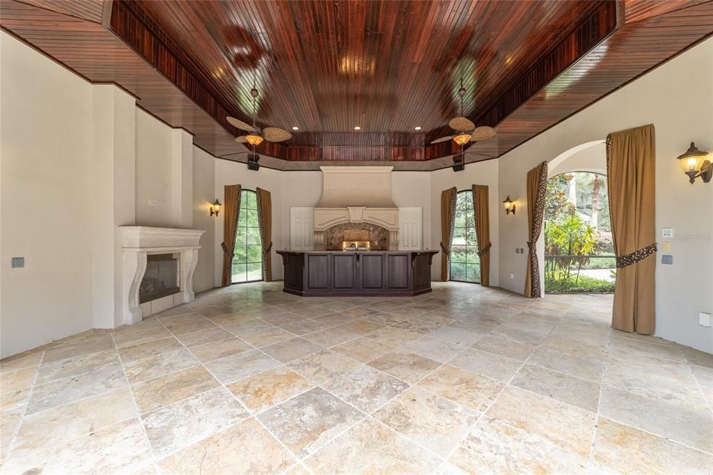 Spectacular pool pavilion w/ fireplace, grill, outdoor kitchen, full bathroom and a storage room covered walkway to billiard/game room
