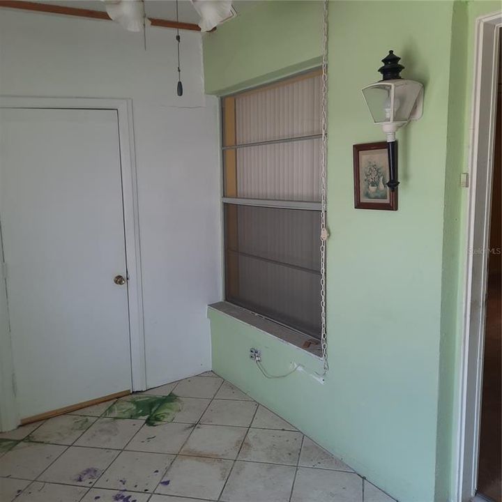 Front enclosed Porch with a storage closet and room for washer and dryer