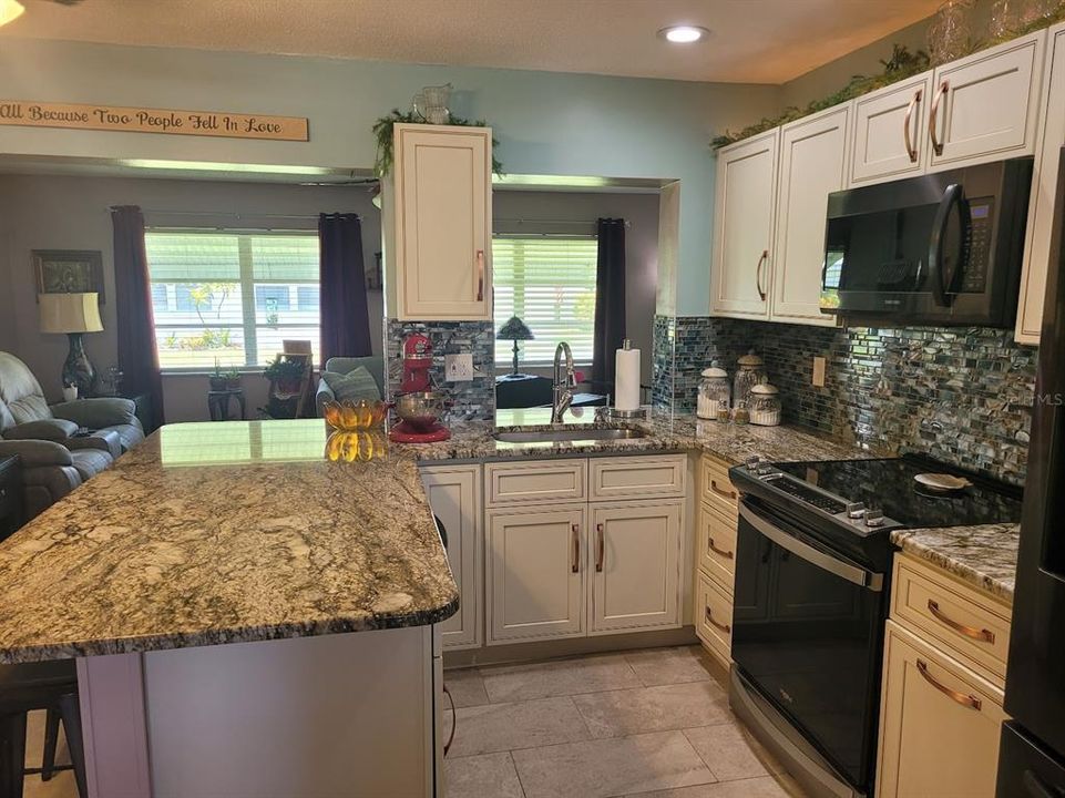 This kitchen is a delight to work in with the countertops, cabinets, and new appliances.