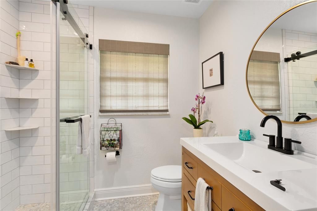 Beautifull renovated, this guest bath offers up a walk-in shower.