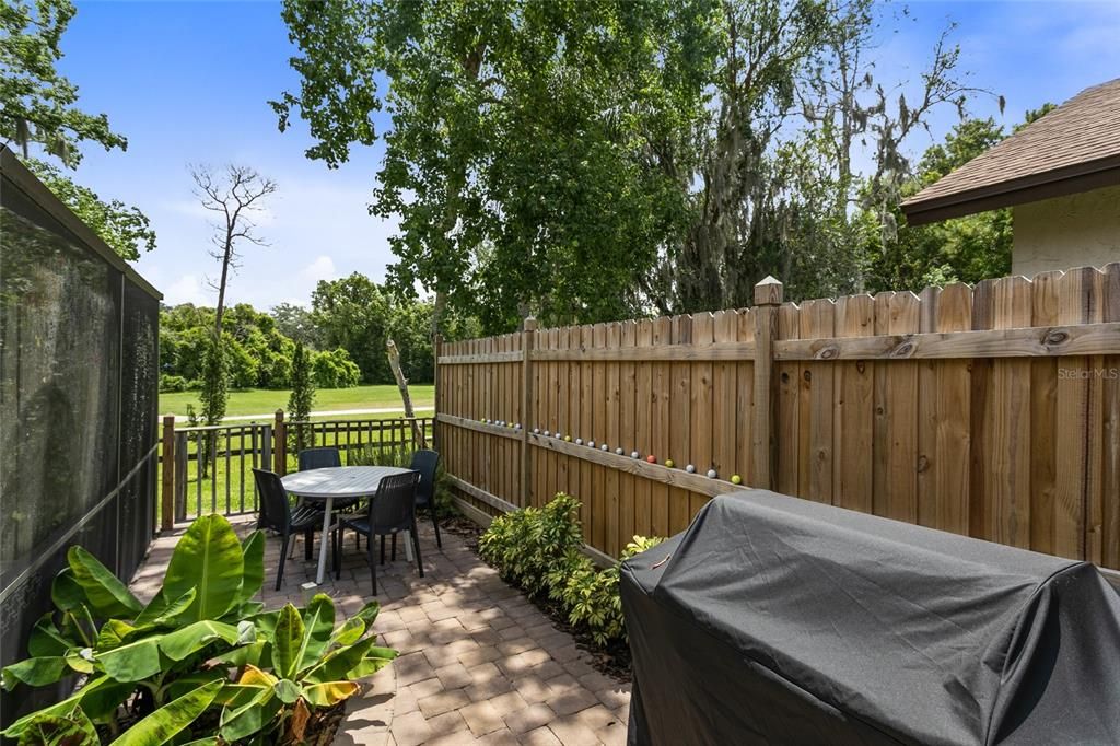 This open patio area off the pool enclosure is IDEAL for grilling!