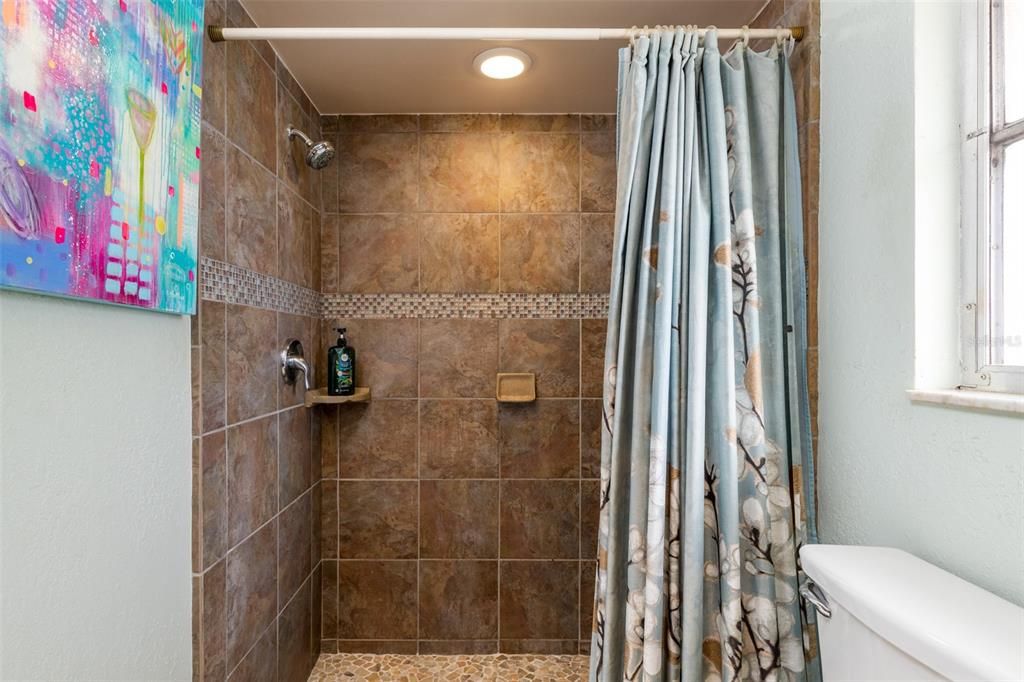 The Shower in the Master Bathroom has beautiful updated tile!