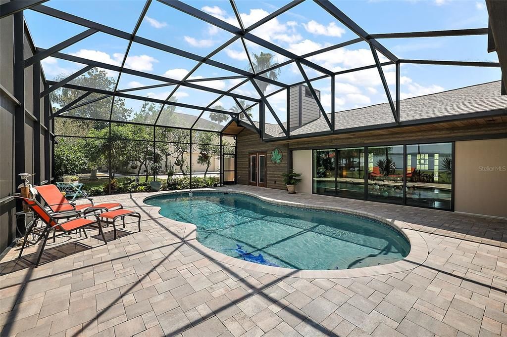 Screen enclosure over the entire pool deck ~