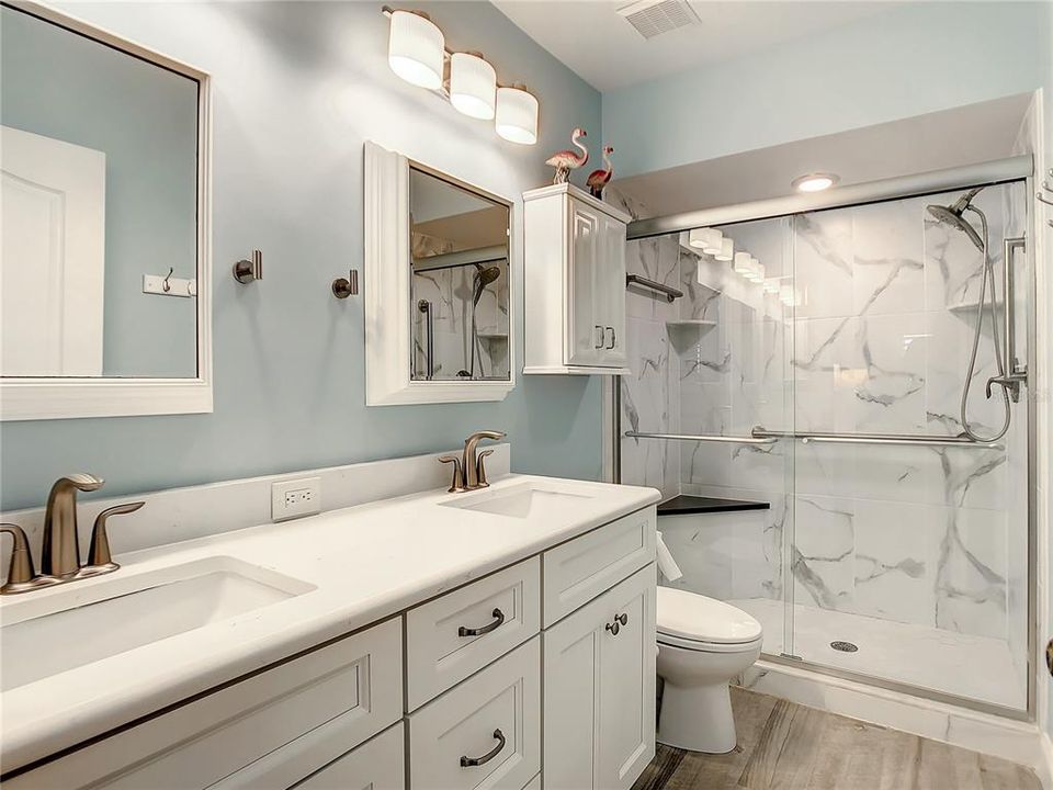 TThe master bedroom retreat is also a nice size and offers a large walk-in closet and an en-suite bath with a new dual sink vanity and a well-appointed stand-up shower. The hall bathroom has been updated with a similar vanity and new flooring