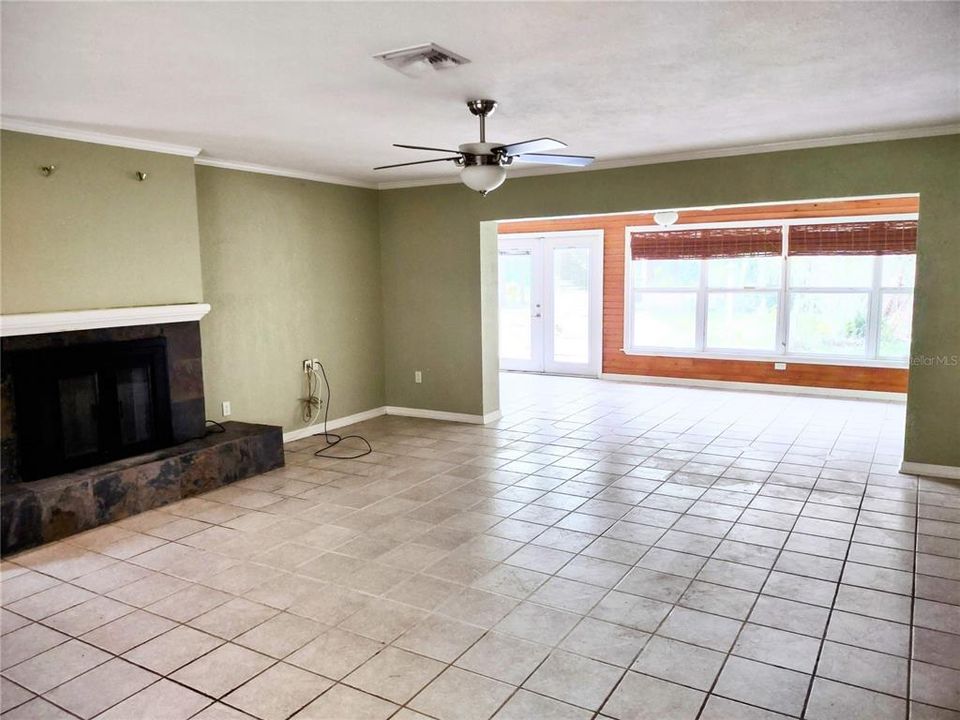 Living room with fireplace and open to Florida room