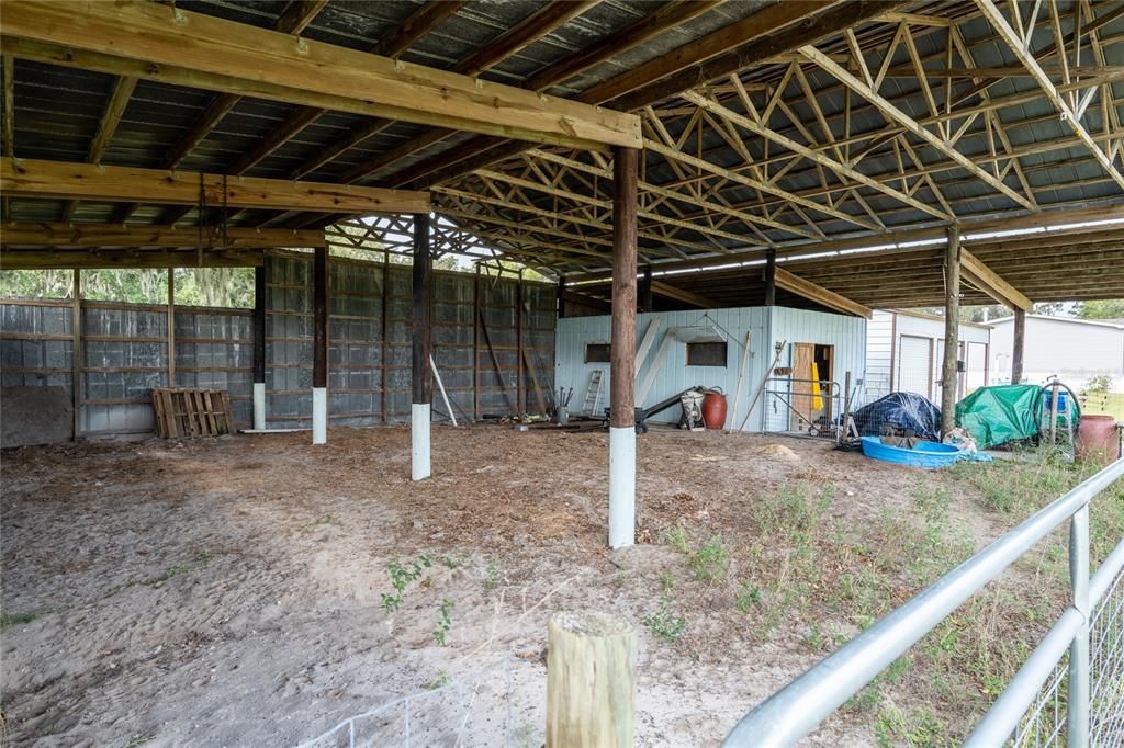 Inside of barn toward storage building.