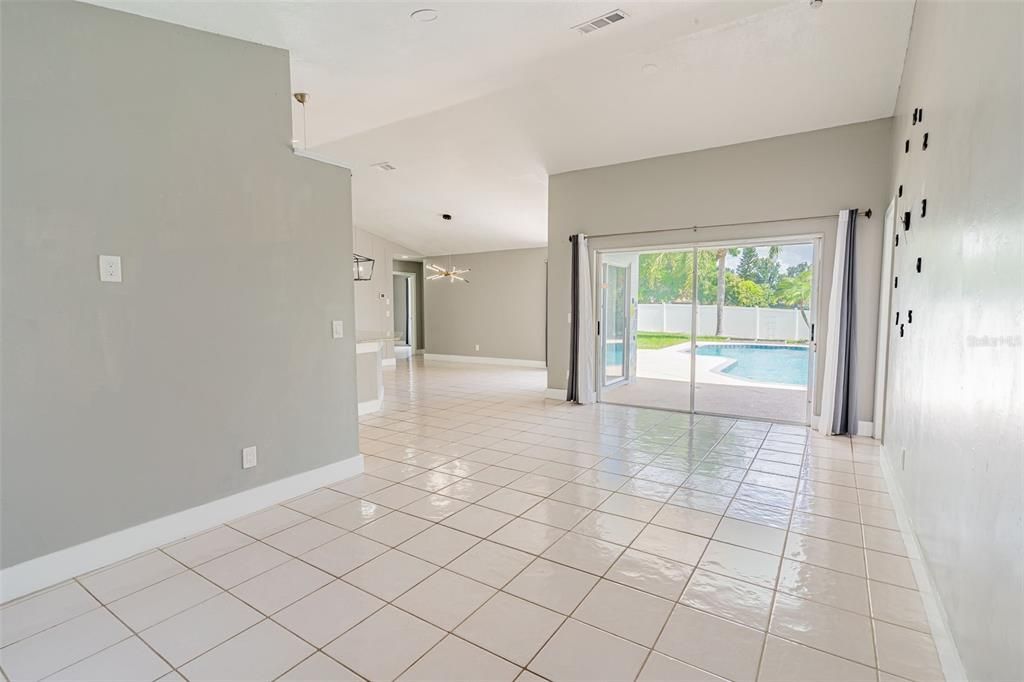 Family Room to sliding doors, leading to the sparkling pool.