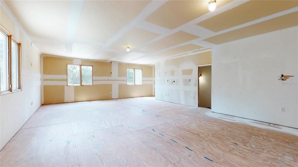 Rough-in In-Law Suite with solid exterior door and stairs down to garage.