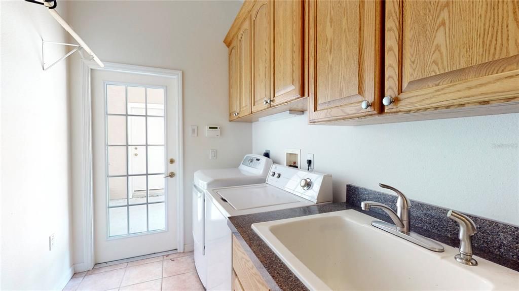 Laundry Room exits out to side of house nearest to workshop