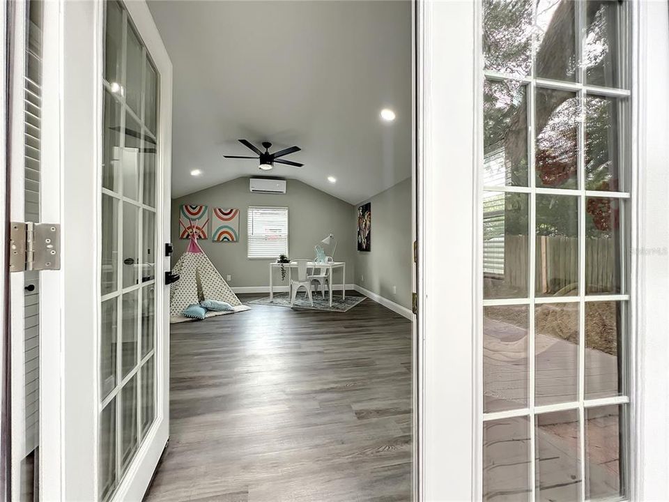 French Doors in Flex Space leading to the Backyard and Deck