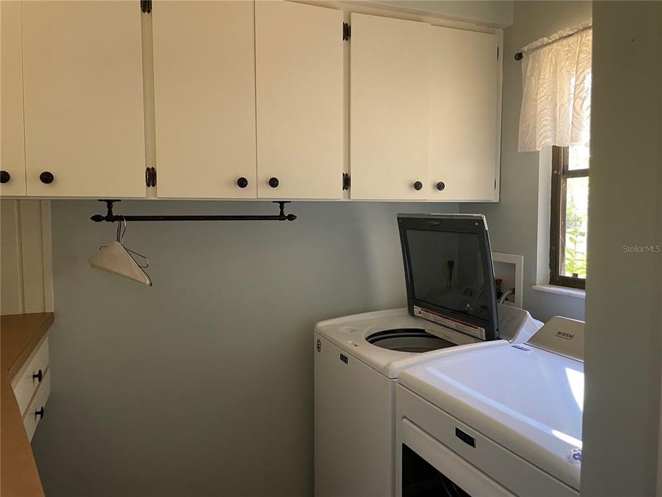 Laundry room is off the kitchen.