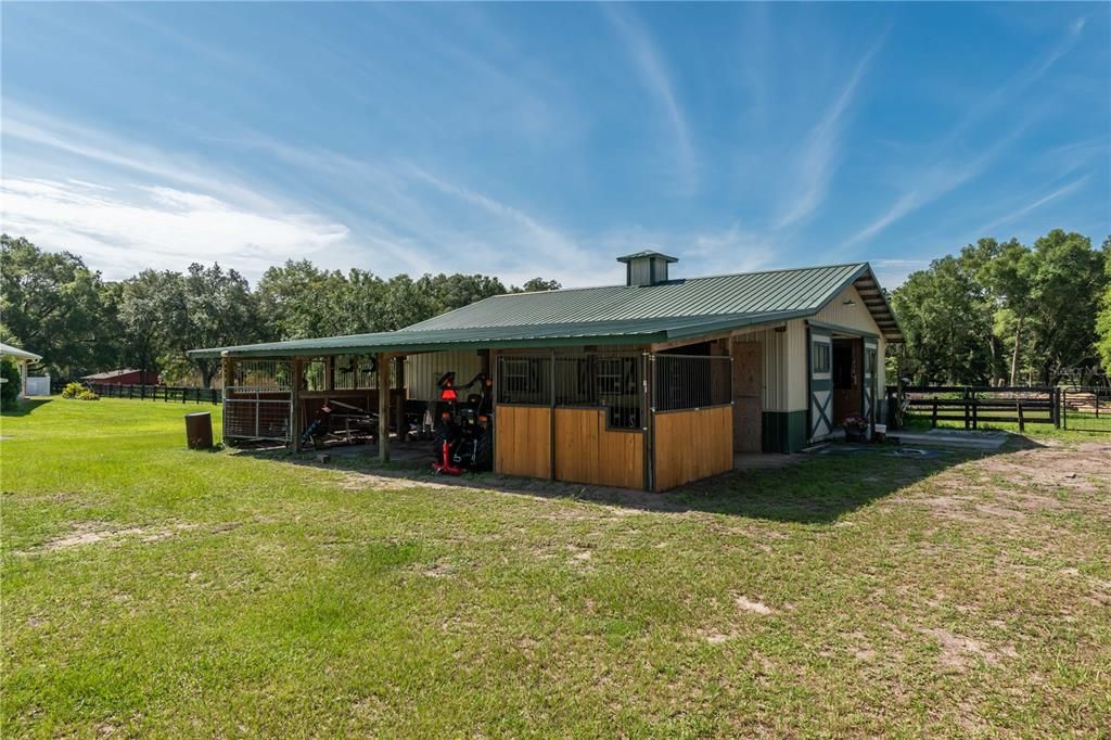 BARN INCLUDES COVERED EQUIPMENT STORAGE