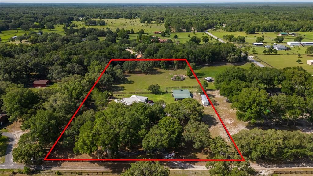 SOUTH FACING AERIAL VIEW OF FARM WITH PARCEL BOUNDARIES NOTED