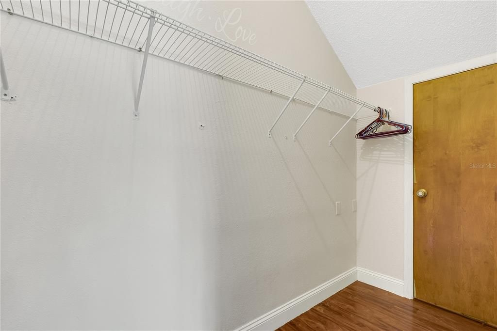 Walk-in closet and extra storage room in second bedroom.