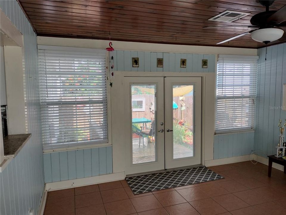 Florida room leading to the outside deck and patio areas