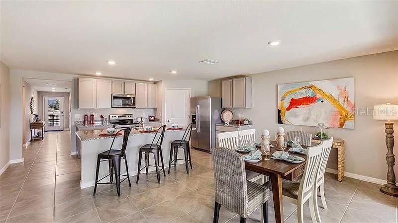 Model home staged kitchen and diningphoto credit DR Horton