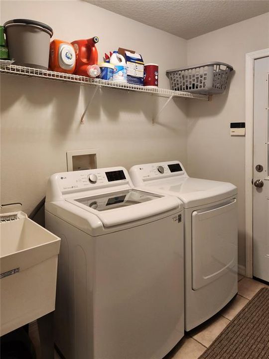 Inside laundry room with sink