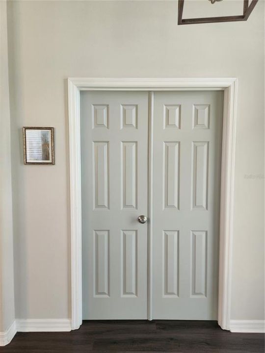 Front bedroom or office with double doors. There is another entrance in the hallway