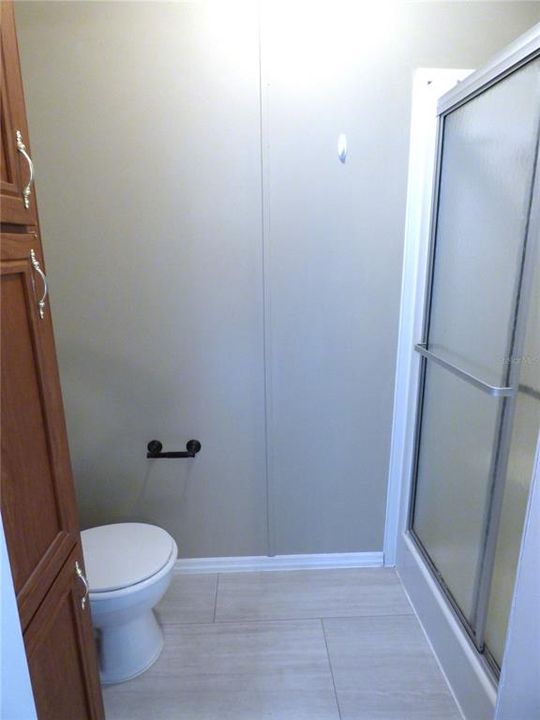 Master shower and built-in cabinet