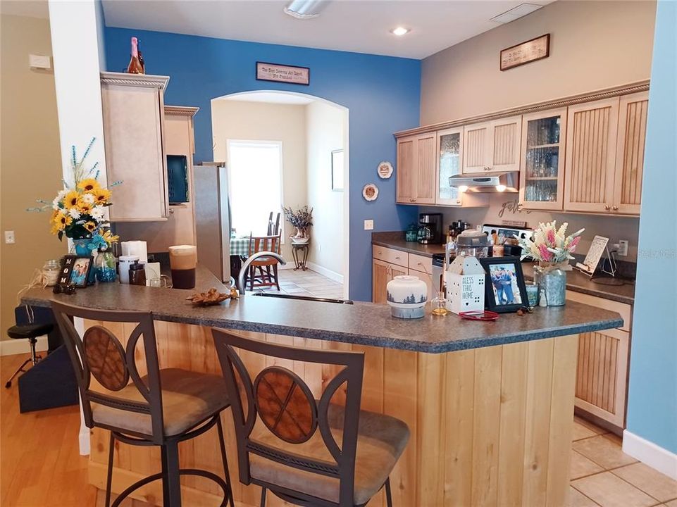 Kitchen and island with barstools