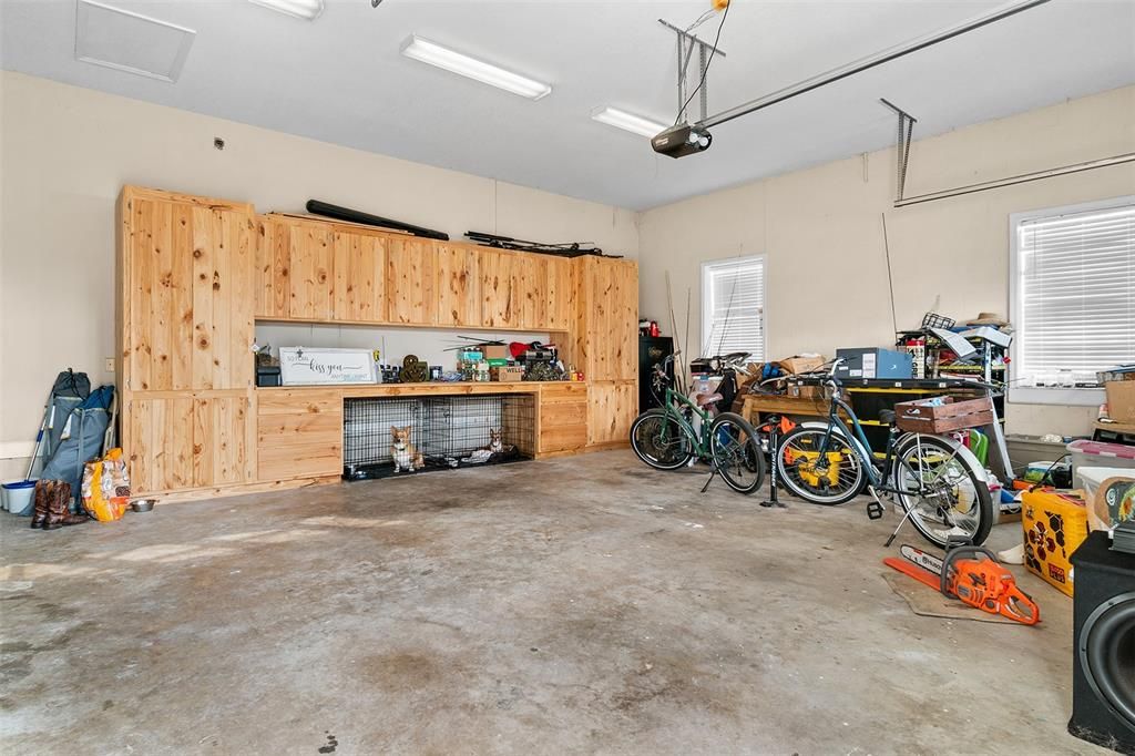 2 car garage with custom wood shelves