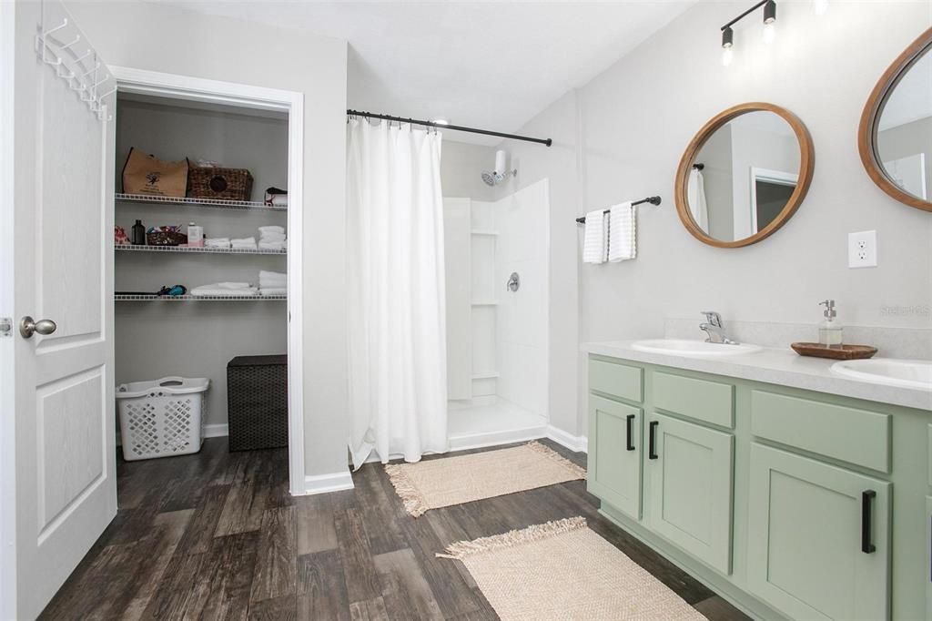 Master Bathroom with walk in linen closet.