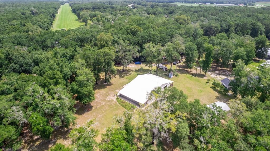 Aerial shows you the 18/36 Lighted Turf runway that is a short taxi way from this property. Click on the video link to see the direction you would taxi to the airstrip.