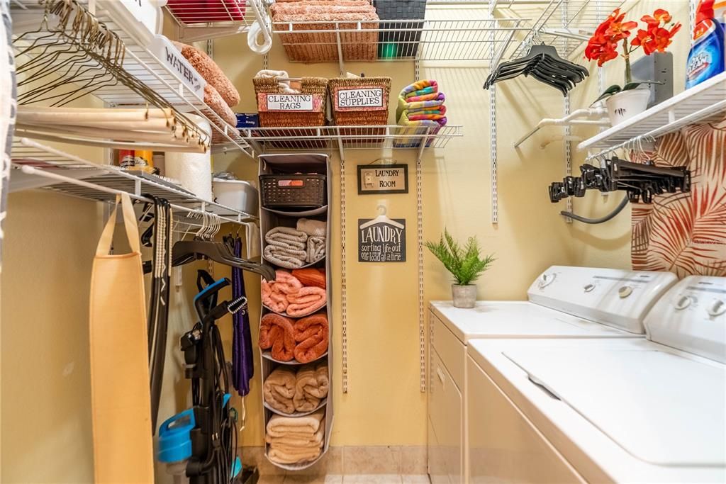 Plenty of shelving in the air conditioned utility room. Washer and Dryer convey.