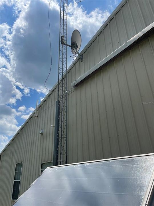 There is still a satellite dish and antenna at the back of the hangar but the home owners now have High speed internet services with Kinetic by Windstream.