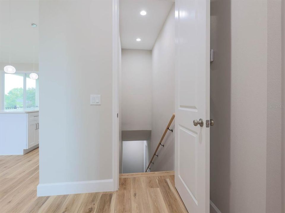 Stairs leading to finished basement