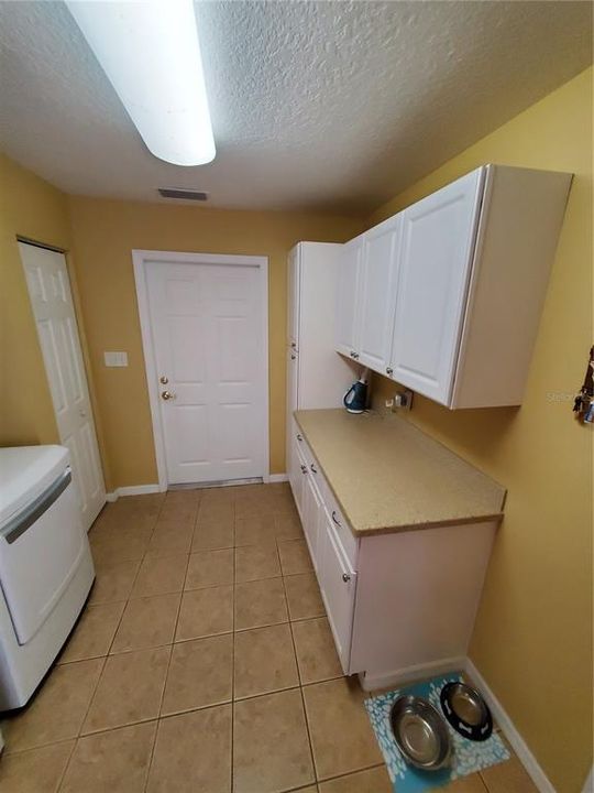 You can never have too much storage!  Check out this wall of extra  cabinetry!