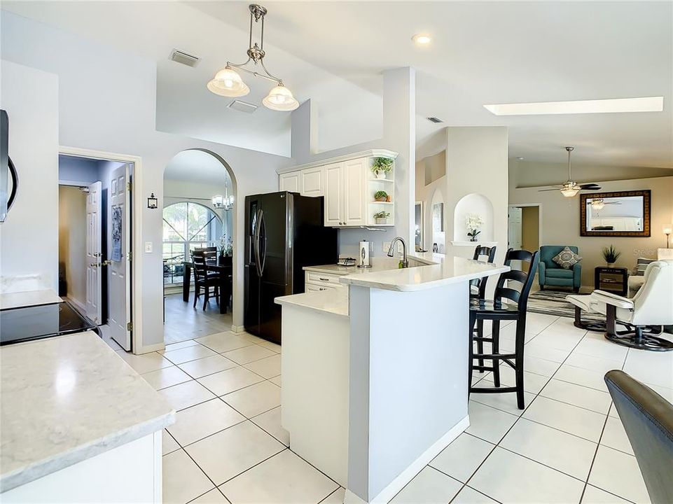 The kitchen is open to the dining room, living room and dinette. Skylights add additional natural lighting.