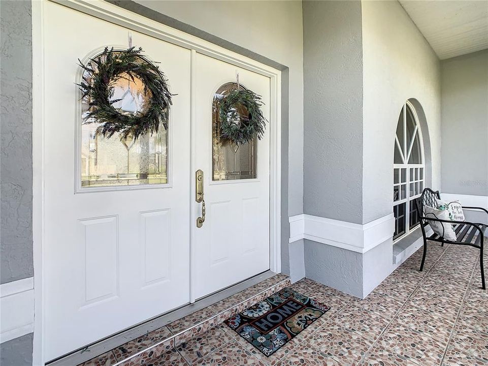 Front entry of the home with double entry doors.