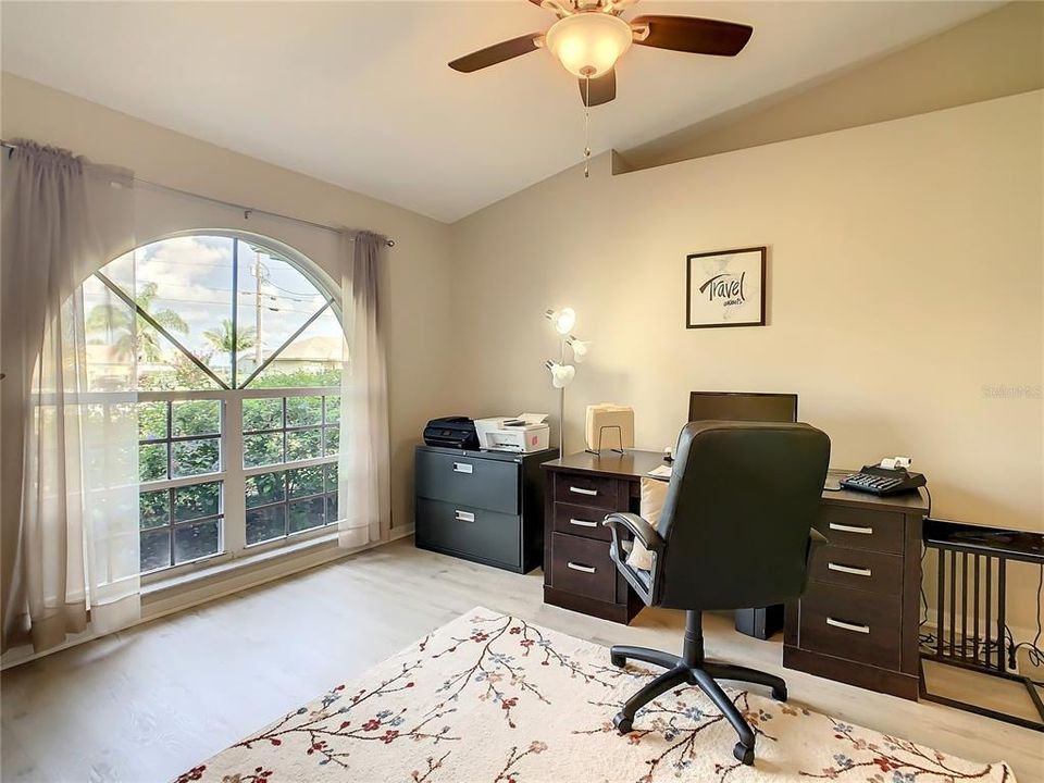 Bedroom #4 is currently used as an office.  This room has the beautiful arched window.  There is no closet in this bedroom, but there is an ideal space for it if the new owner chooses to put one in.