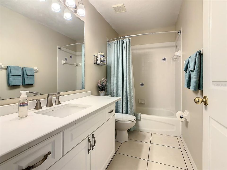Guest bathroom with quartz countertop.