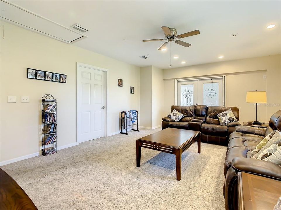 Family room has recessed lighting and 2 ceiling fans with LED lighting.
