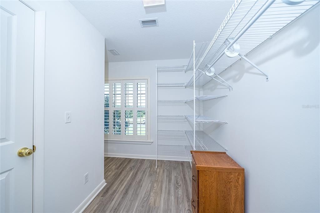 Walk In Closet wraps around for extra storage area