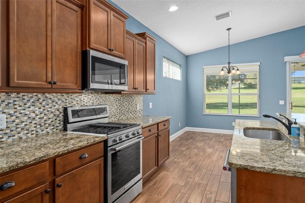 The kitchen provides good workspace and flows easily into the dining area.