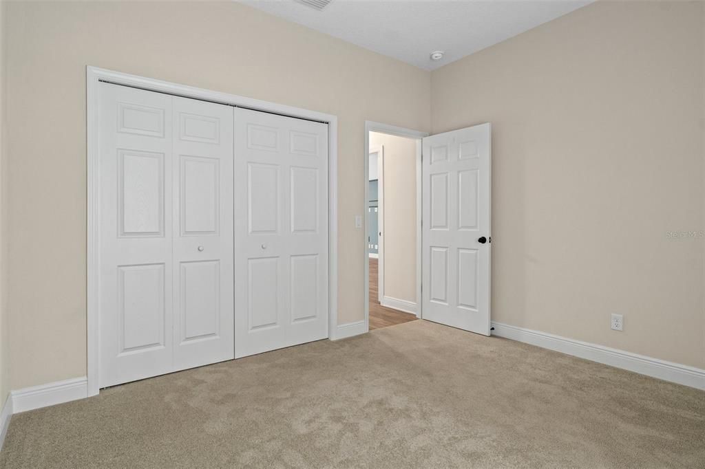 Opposite view of guest bedroom, looking back toward the bedroom entry door.