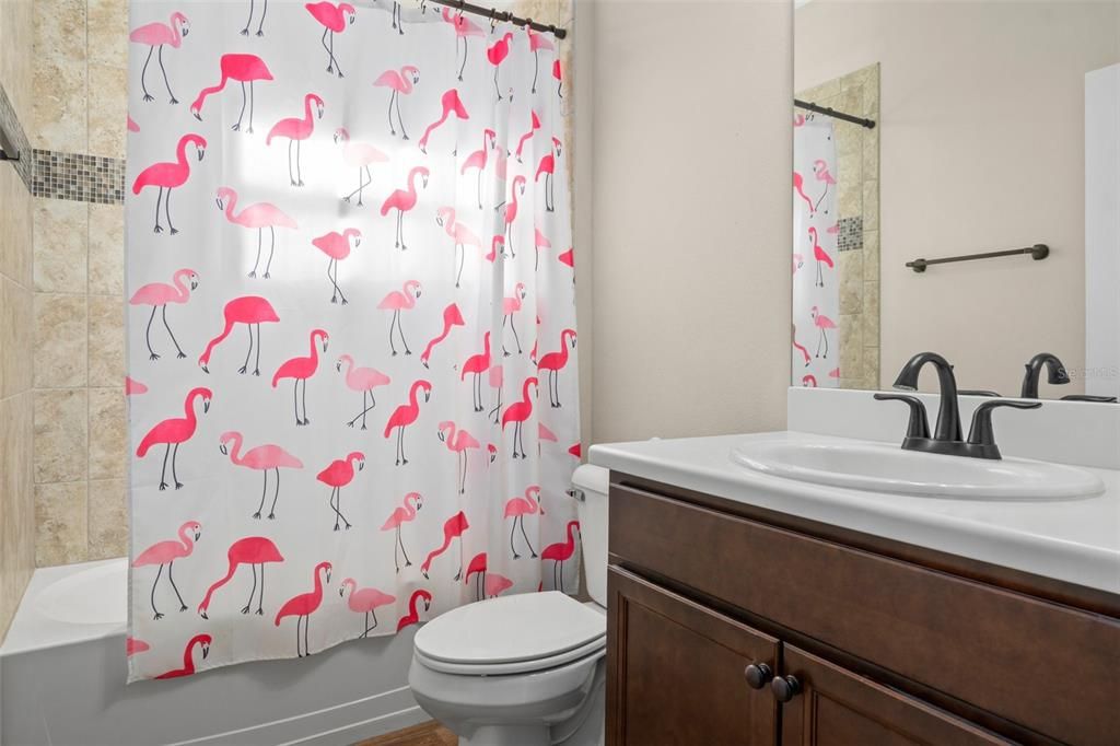 The hall guest bath also features a comfort height vanity.