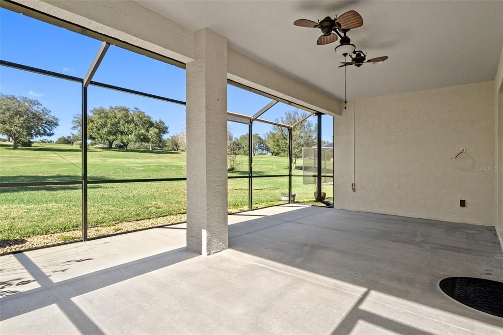 The extended lanai, just off the great room, overlooks a beautiful and serene setting. Hard to believe sometimes that you even have neighbors! There is a gas line on the wall to attach a natural gas grill - no more changing out propane tanks!