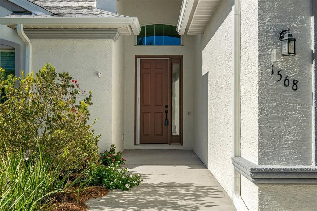 The entryway has a retractable screen door that stays out of the way until needed, as well as a Ring doorbell.