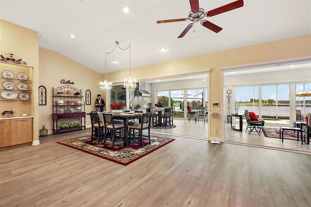 Dining area w/2 chandeliers & stackable sliders to lanai