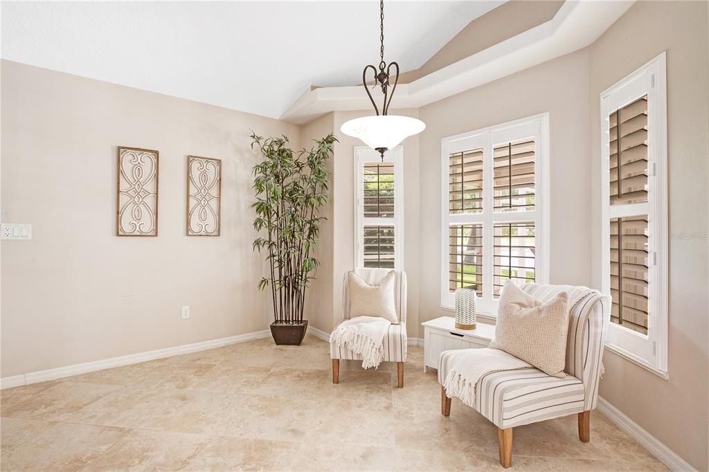 Cute Dinette Nook that sits perfectly overlooking Covered Patio and Water View