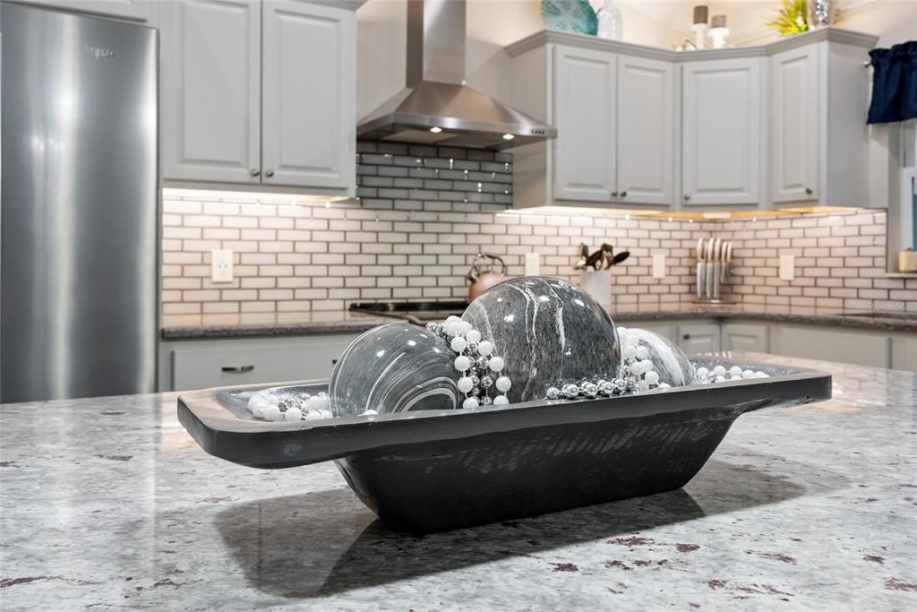 Close up view of KITCHEN ISLAND w/ GRANITE COUNTER