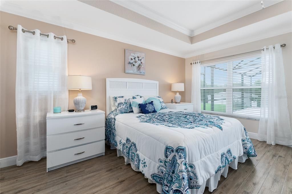 PRIMARY/MASTER BEDROOM features a TRAY CEILING w/ CROWN MOLDING