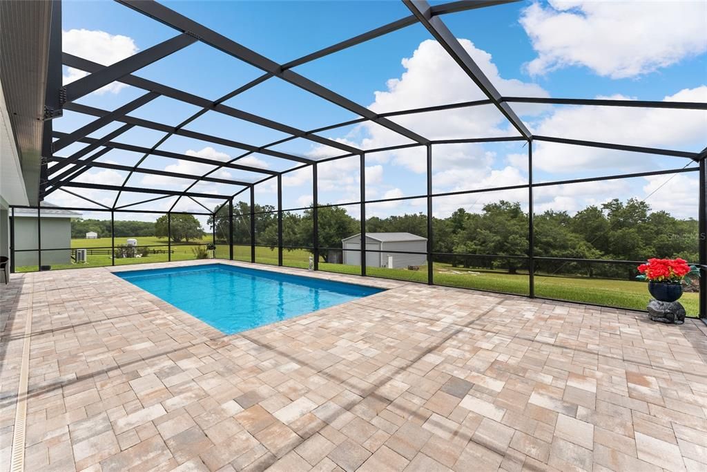 Another view of SWIMMING POOL with SCREEN ENCLOSURE